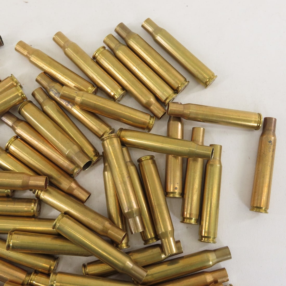 70 Brass .03-06 primed cases & .30 cal links - 5