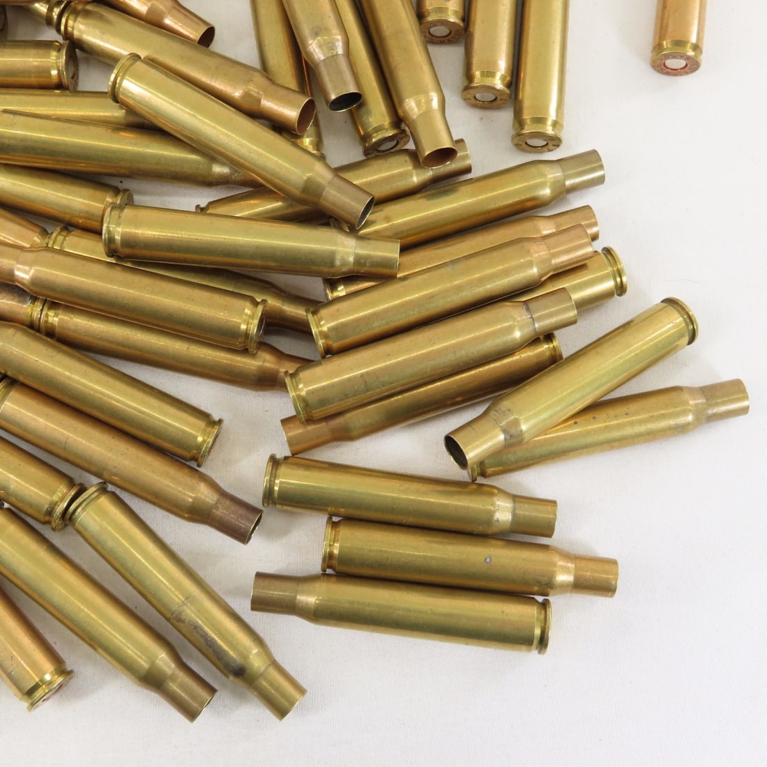 70 Brass .03-06 primed cases & .30 cal links - 6