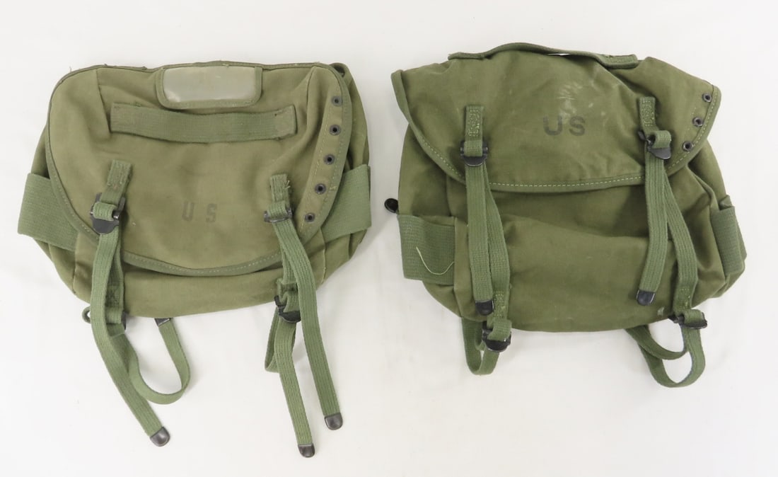 2 Cold-War era canvas rucksacks: 2 Cold-War era canvas rucksacks - Field Pack Combat M-1961, from two different vendors. One is in excellent condition, with a DRMO release stenciling inside the main flap, the other is in good used