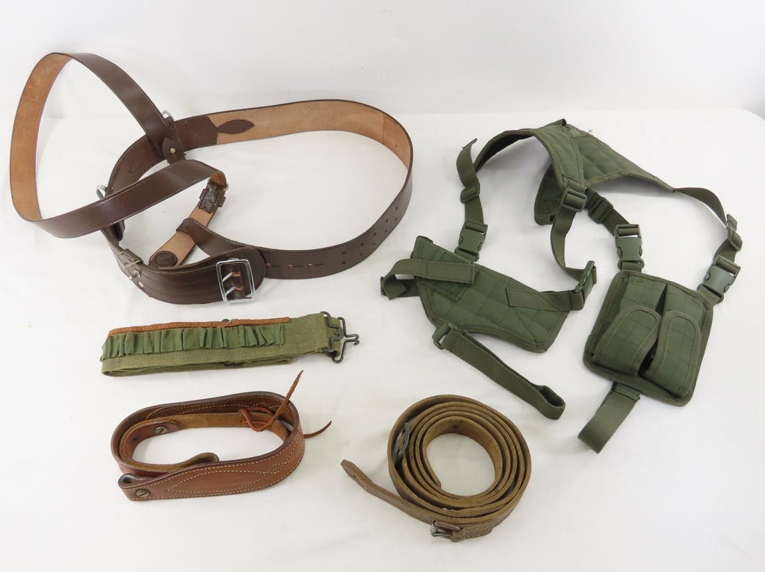 Non-US military and civilian holsters and slings: Non-US military and civilian holsters and slings - including a reproduction Sam Browne belt. Lot Size 10x10x6" 2 LB All information and photos are intended to be as accurate as possible, but errors ar