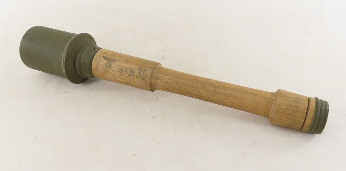 WWII Era German Model 24 Stick Grenade Wood Dummy: WWII Era German Model 24 Stick Grenade Wood Dummy - Inert, wood Training Dummy. Also known as "Potato Masher", Stamped with Reichsadler and WAA35. Lot Size: 15 x 3 x 3", 1 lb All information and photo