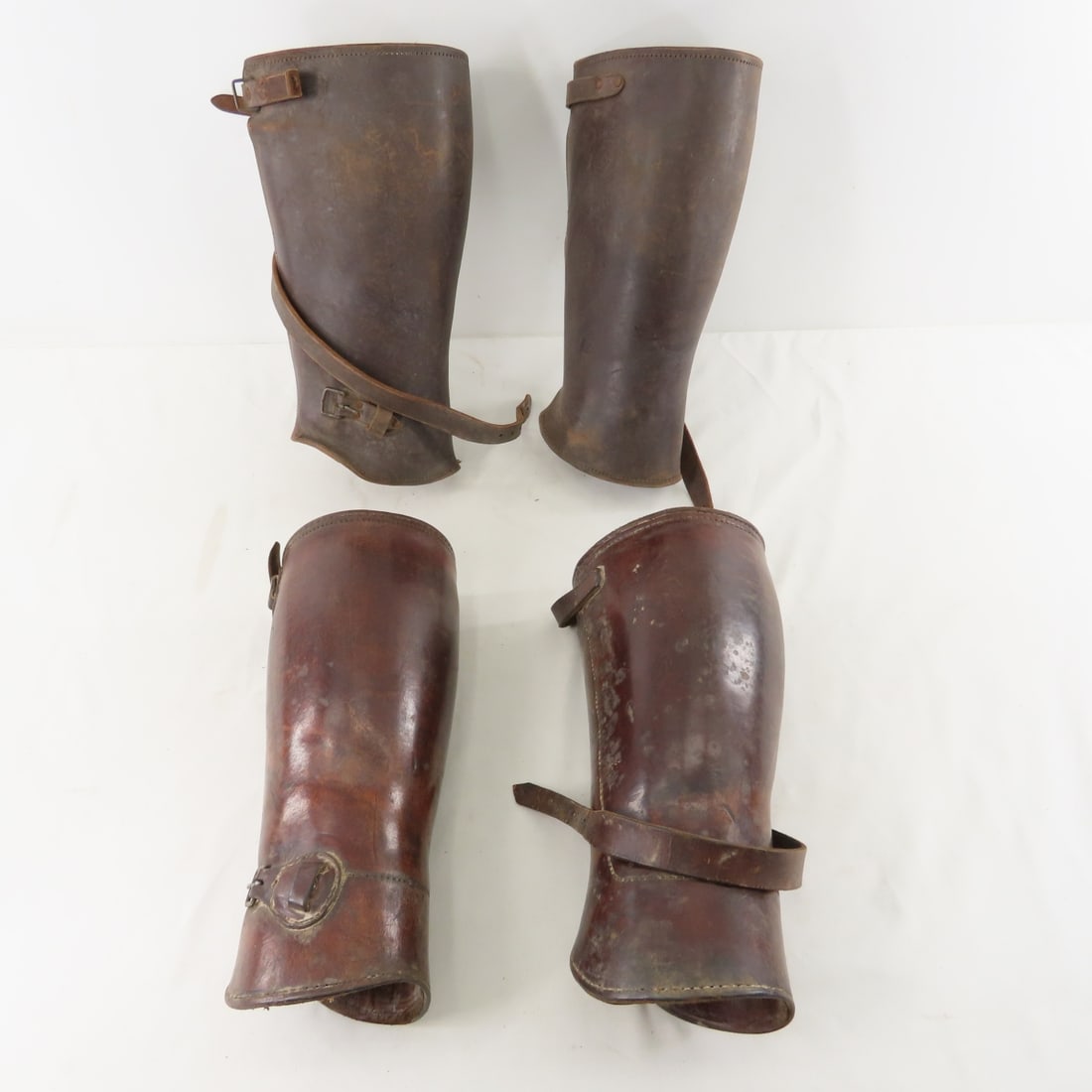 2 Pair WWI Leather Officer's Leggings: 2 Pair WWI Leather Officer's Leggings - 12" pair marked "14 600553423" on inside, other is unmarked and are 11.5". LOT SIZE: 12x9x7", 4 lbs All information and photos are intended to be as accurate
