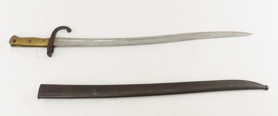 French Chassepot bayonet with scabbard: French Chassepot bayonet with scabbard - 22 3/4" Blade 27 3/4" Overall length. Top of blade marked Tulle Septembre 1873. Lot Size 28x5x2" 4 LB All information and photos are intended to be as