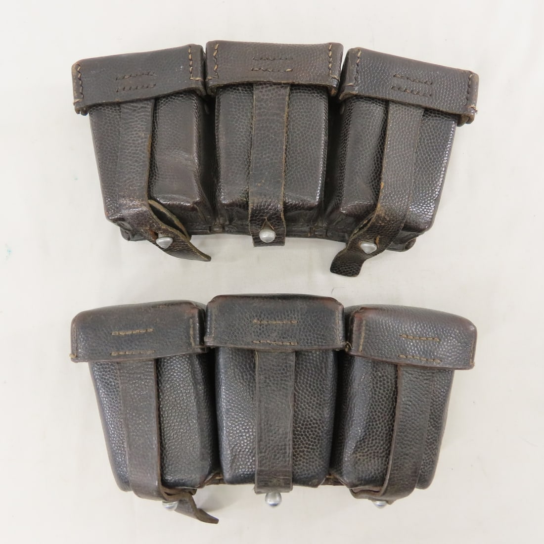 2 WWII German Ammunition Pouches: 2 WWII German Ammunition Pouches - Lot Size 9x5x4" 3 LB All information and photos are intended to be as accurate as possible, but errors are possible. No item may be returned or refused based on