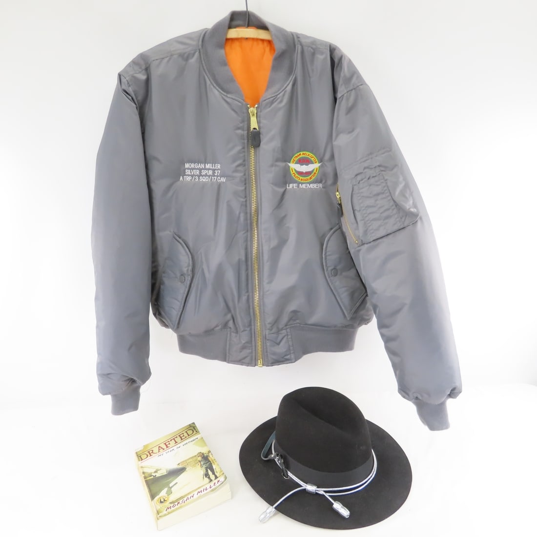 Vietnam Helicopter Pilot Jacket, Hat & Book: Vietnam Helicopter Pilot Jacket, Hat & Book - From Soldier Morgan Miller. Lot Size 12x12x12" 6 LB All information and photos are intended to be as accurate as possible, but errors are possible. No