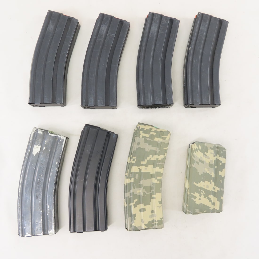 8 Assorted AR/M16 5.56/.223 Metal Magazines: 8 Assorted AR/M16 5.56/.223 Metal Magazines - 30 rounds: 4 ASC, 1 Windham Weaponry, 1 Center Industries, 1 D&H Industries- camo, and 1 20 round Universal Industries M16. LOT SIZE: 8x8x4", 3 LBS All