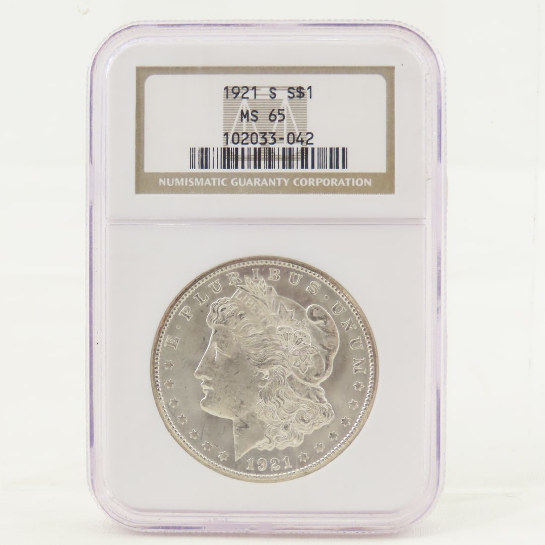 1921 S Morgan Silver Dollar NGC MS65: 1921 S Morgan Silver Dollar NGC MS65 - Lot Size 4x3x1" 1 LB All information and photos are intended to be as accurate as possible, but errors are possible. No item may be returned or refused based on