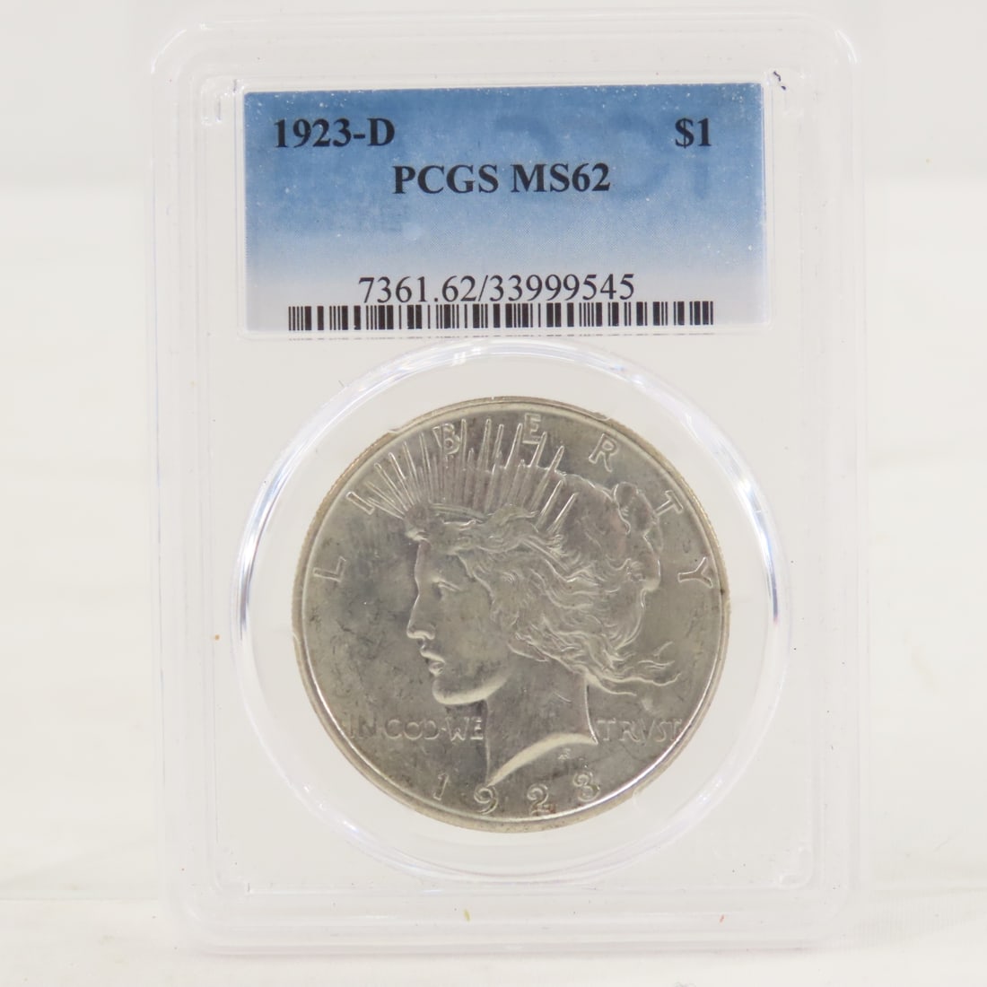 1923 D Peace Silver Dollar PCGS MS62: 1923 D Peace Silver Dollar PCGS MS62 - Lot Size 4x3x1" 1 LB All information and photos are intended to be as accurate as possible, but errors are possible. No item may be returned or refused based on