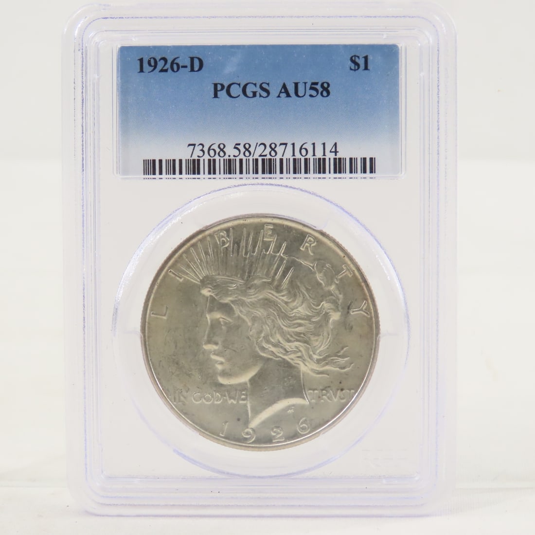 1926 D Peace Silver Dollar PCGS AU58: 1926 D Peace Silver Dollar PCGS AU58 - Lot Size 4x3x1" 1 LB All information and photos are intended to be as accurate as possible, but errors are possible. No item may be returned or refused based on