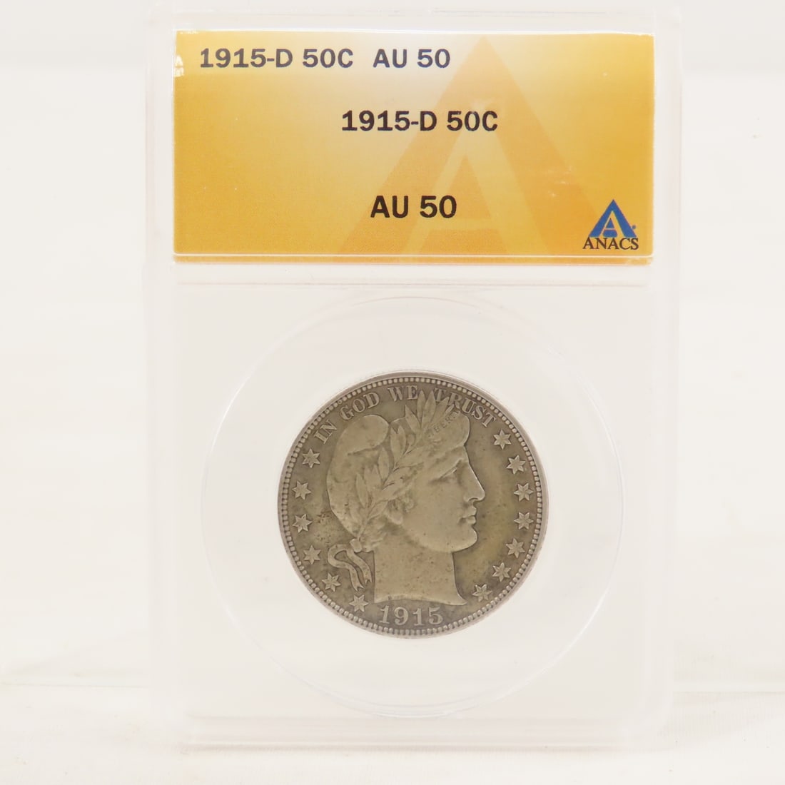1915 D Barber Silver Half Dollar ANACS AU50: 1915 D Barber Silver Half Dollar ANACS AU50 - Lot Size 4x3x1" 1 LB All information and photos are intended to be as accurate as possible, but errors are possible. No item may be returned or refused ba