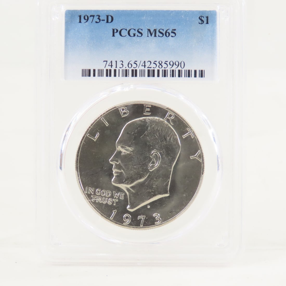 1973 D Eisenhower Dollar PCGS MS65: 1973 D Eisenhower Dollar PCGS MS65 - Lot Size 4x3x1" 1 LB All information and photos are intended to be as accurate as possible, but errors are possible. No item may be returned or refused based on