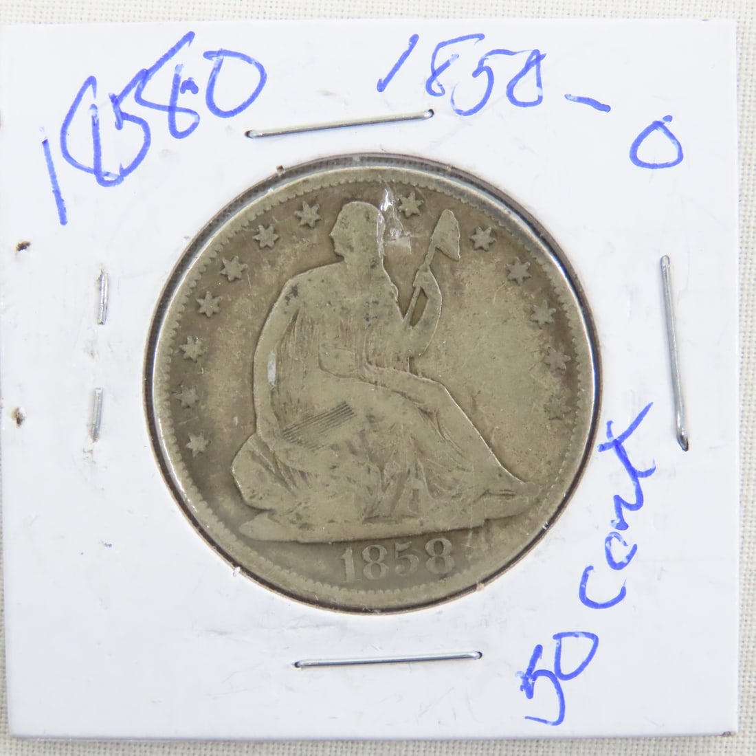 1858 O Seated Liberty Silver Half Dollar: 1858 O Seated Liberty Silver Half Dollar - Lot Size 2x2x2" 1 LB All information and photos are intended to be as accurate as possible, but errors are possible. No item may be returned or refused based