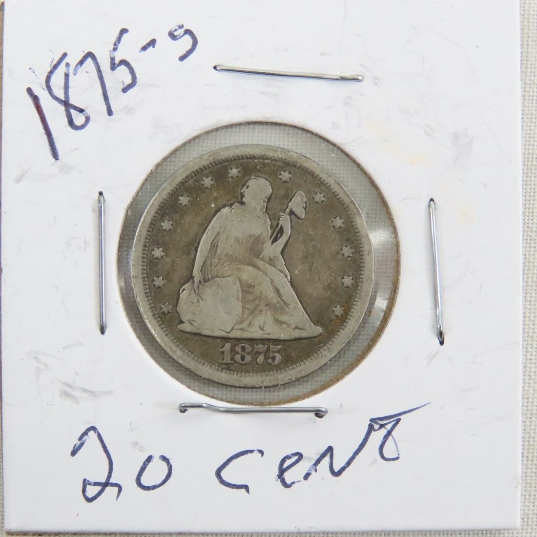 1875 S Seated Liberty 20 Cent: 1875 S Seated Liberty 20 Cent - Lot Size 2x2x2" 1 LB All information and photos are intended to be as accurate as possible, but errors are possible. No item may be returned or refused based on this