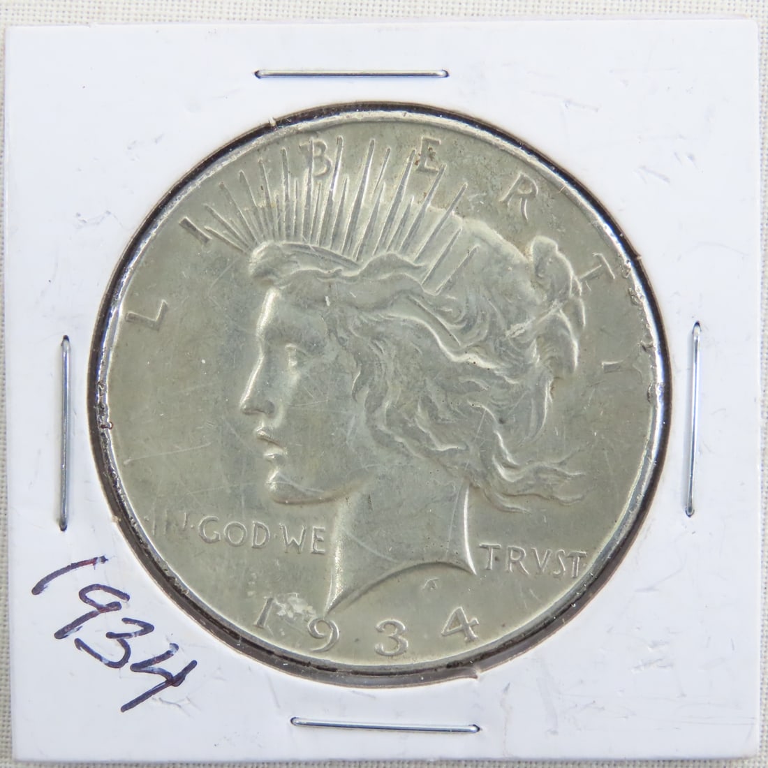1934 Peace Silver Dollar: 1934 Peace Silver Dollar - Lot Size 2x2x2" 1 LB All information and photos are intended to be as accurate as possible, but errors are possible. No item may be returned or refused based on this informa