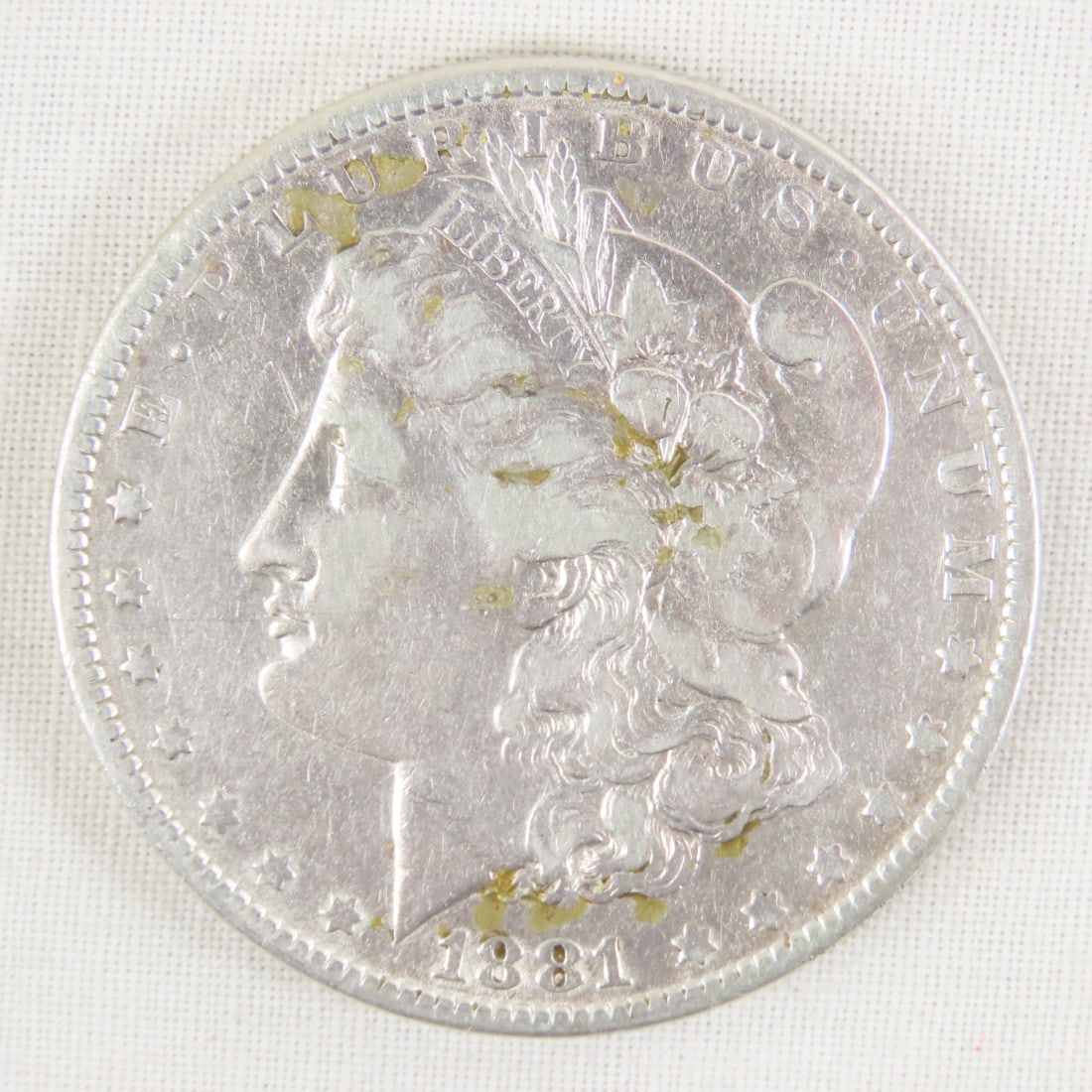 1881 Morgan Silver Dollar: 1881 Morgan Silver Dollar - Lot Size 2x2x1" 1 LB All information and photos are intended to be as accurate as possible, but errors are possible. No item may be returned or refused based on this
