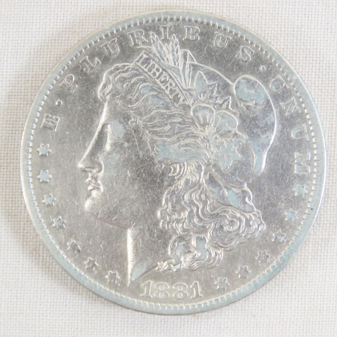 1881 O Morgan Silver Dollar: 1881 O Morgan Silver Dollar - Lot Size 2x2x1" 1 LB All information and photos are intended to be as accurate as possible, but errors are possible. No item may be returned or refused based on this