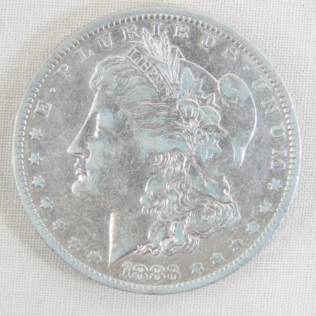 1883 O Morgan Silver Dollar: 1883 O Morgan Silver Dollar - Lot Size 2x2x1" 1 LB All information and photos are intended to be as accurate as possible, but errors are possible. No item may be returned or refused based on this info