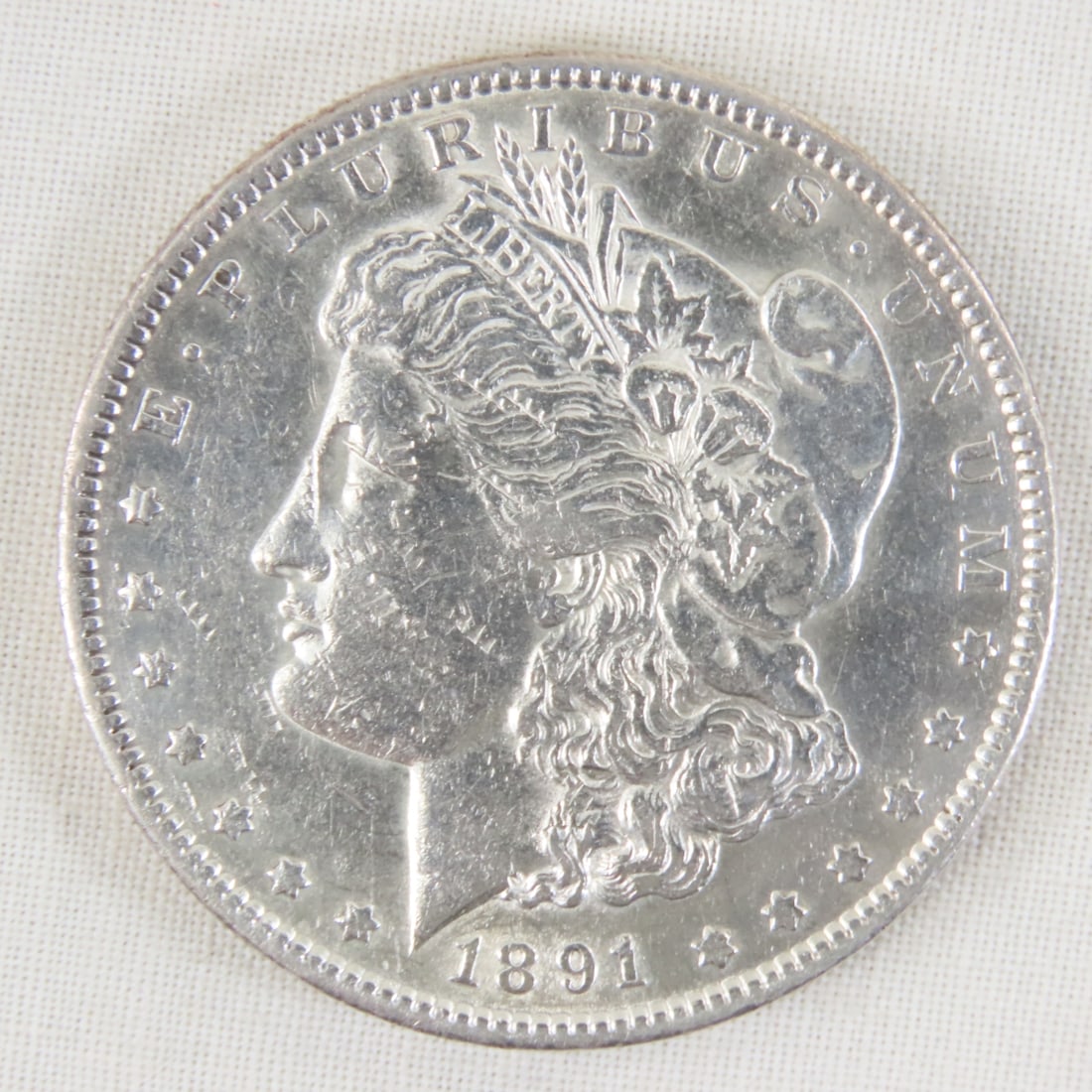 1891 S Morgan Silver Dollar: 1891 S Morgan Silver Dollar - Lot Size 2x2x1" 1 LB All information and photos are intended to be as accurate as possible, but errors are possible. No item may be returned or refused based on this info