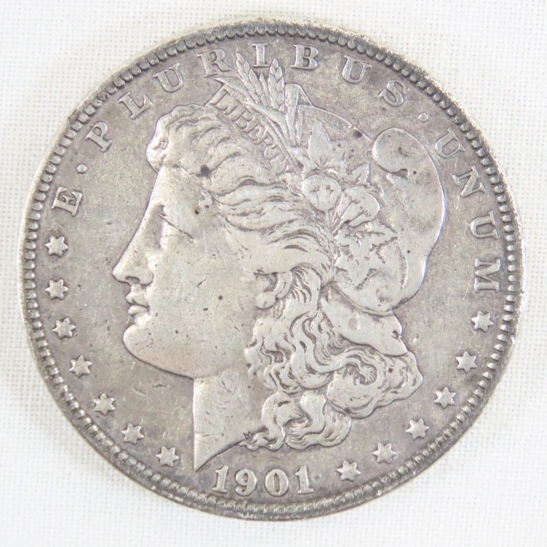 1901 O Morgan Silver Dollar: 1901 O Morgan Silver Dollar - Lot Size 2x2x1" 1 LB All information and photos are intended to be as accurate as possible, but errors are possible. No item may be returned or refused based on this info