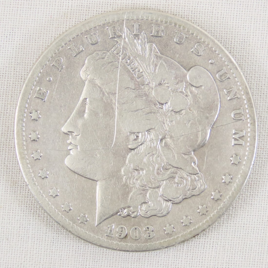 1903 S Morgan Silver Dollar: 1903 S Morgan Silver Dollar - Lot Size 2x2x1" 1 LB All information and photos are intended to be as accurate as possible, but errors are possible. No item may be returned or refused based on this