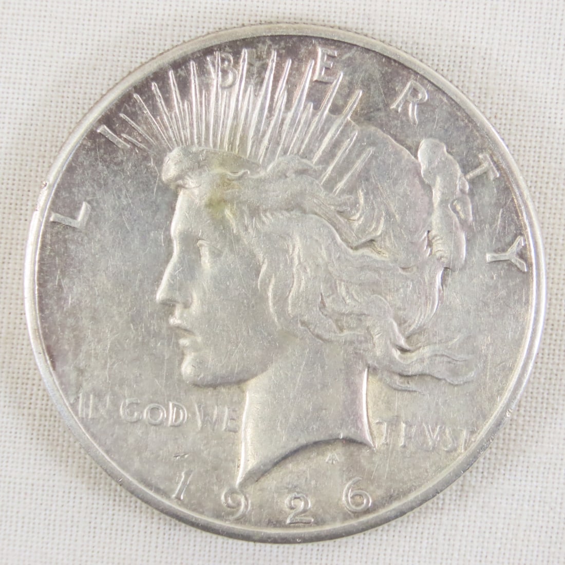 1926 S Peace Silver Dollar: 1926 S Peace Silver Dollar - Lot Size 2x2x1" 1 LB All information and photos are intended to be as accurate as possible, but errors are possible. No item may be returned or refused based on this
