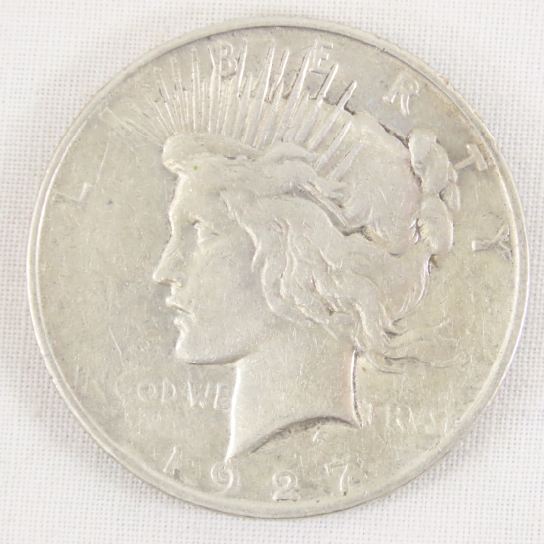 1927 D Peace Silver Dollar: 1927 D Peace Silver Dollar - Lot Size 2x2x1" 1 LB All information and photos are intended to be as accurate as possible, but errors are possible. No item may be returned or refused based on this