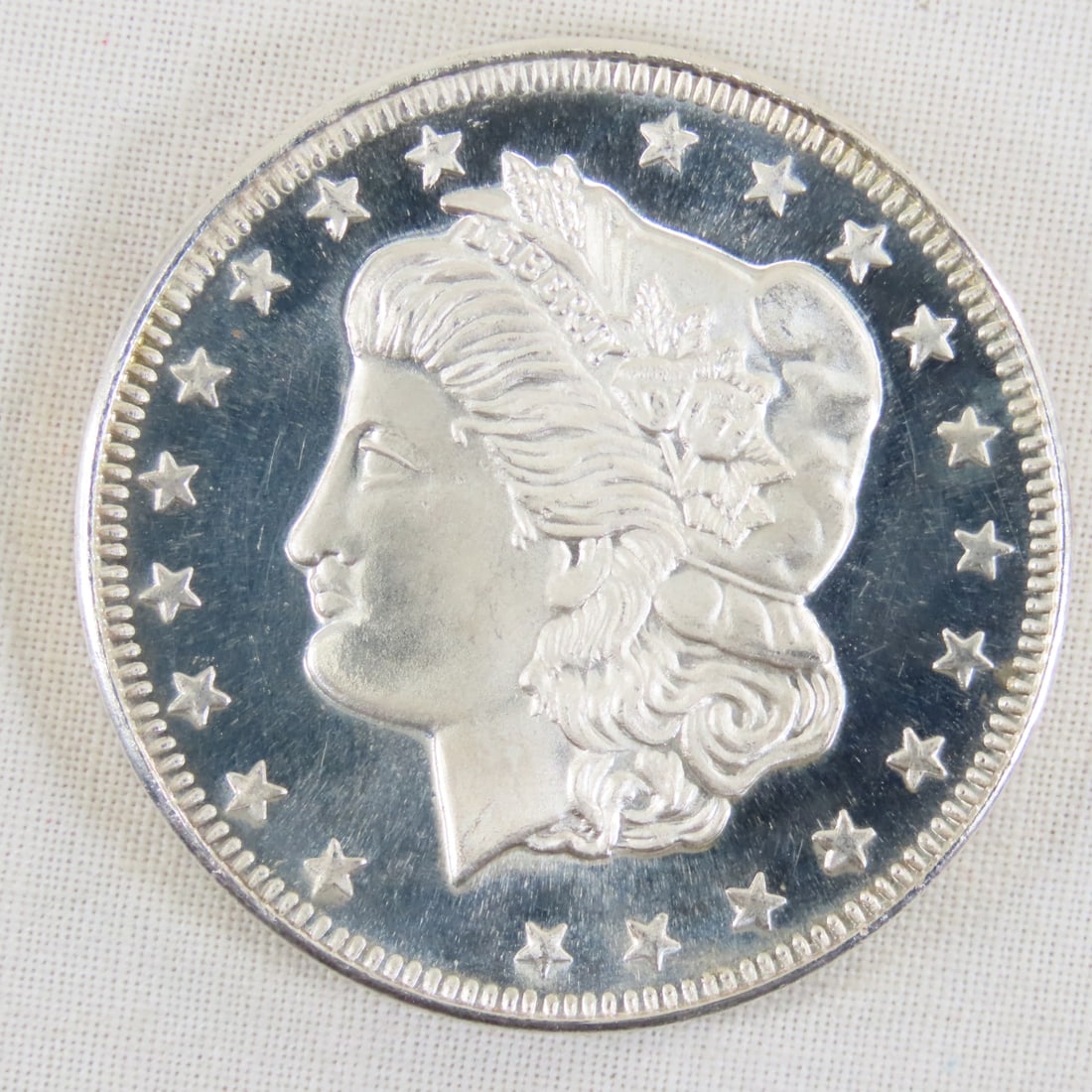 Morgan Dollar Style 1ozt .999 Silver Round: Morgan Dollar Style 1ozt .999 Silver Round - Lot Size 2x2x1" 1 LB All information and photos are intended to be as accurate as possible, but errors are possible. No item may be returned or refused bas