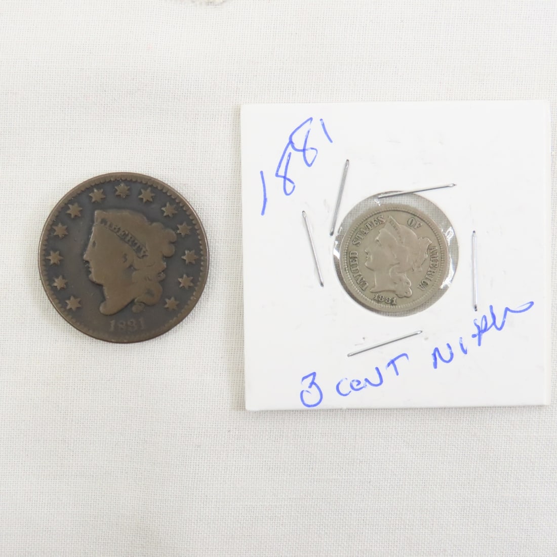 1881 3 Cent Nickel & 1831 Coronet Head Large Cent: 1881 3 Cent Nickel & 1831 Coronet Head Large Cent - Lot Size 2x2x2" 1 LB All information and photos are intended to be as accurate as possible, but errors are possible. No item may be returned or