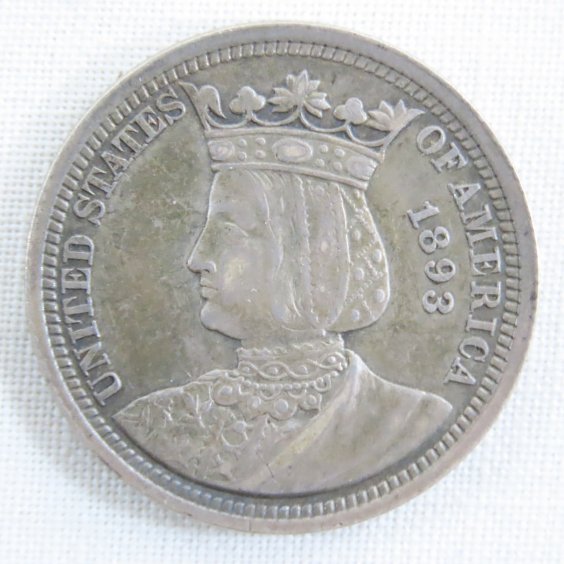 1893 Isabella Columbian Exposition Silver Quarter: 1893 Isabella Columbian Exposition Silver Quarter - United States' first commemorative quarter dollar. Congress authorized the piece at the request of the Board of Lady Managers of the World's