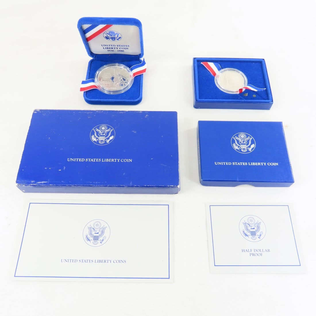 1986 Liberty Proof Silver Dollar & Half Dollar: 1986 Liberty Proof Silver Dollar & Half Dollar - Lot Size 7x4x2" 1 LB All information and photos are intended to be as accurate as possible, but errors are possible. No item may be returned or