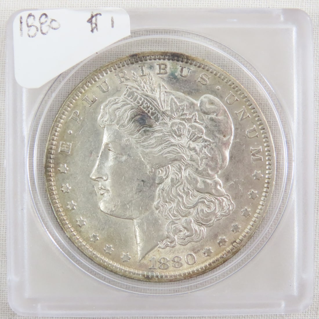 1880 Morgan Silver Dollar: 1880 Morgan Silver Dollar - Lot Size 2x2x1" 1 LB All information and photos are intended to be as accurate as possible, but errors are possible. No item may be returned or refused based on this inform
