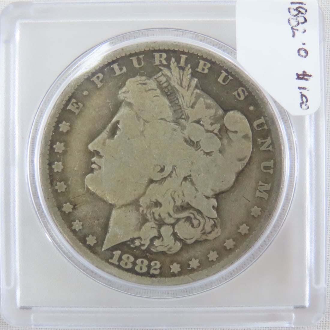 1882 O Morgan Silver Dollar: 1882 O Morgan Silver Dollar - Lot Size 2x2x1" 1 LB All information and photos are intended to be as accurate as possible, but errors are possible. No item may be returned or refused based on this