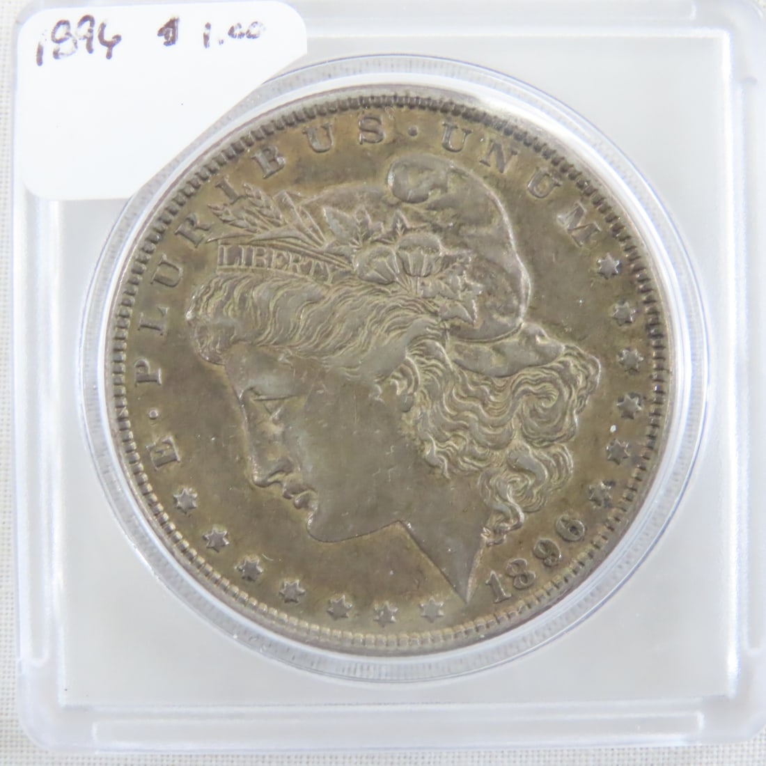 1896 Morgan Silver Dollar: 1896 Morgan Silver Dollar - Lot Size 2x2x1" 1 LB All information and photos are intended to be as accurate as possible, but errors are possible. No item may be returned or refused based on this inform