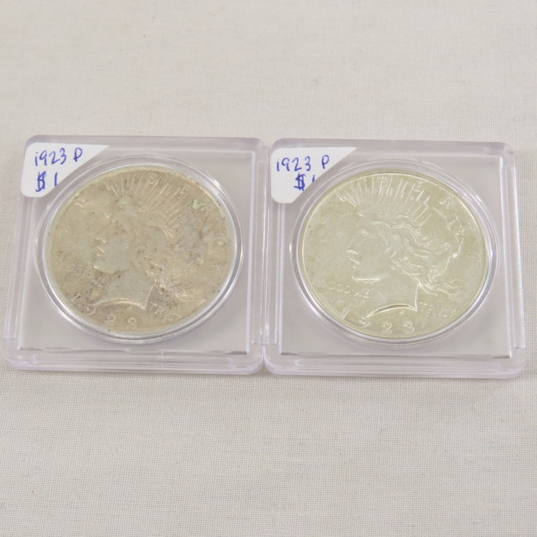 1923 P&D Peace Silver Dollars: 1923 P&D Peace Silver Dollars - Lot Size 2x2x2" 1 LB All information and photos are intended to be as accurate as possible, but errors are possible. No item may be returned or refused based on this in