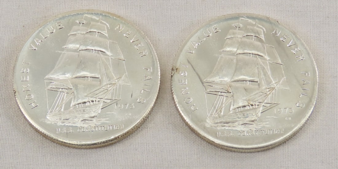 2 1973 USS Constitution 1 ozt Silver Rounds: 2 1973 USS Constitution 1 ozt Silver Rounds - Lot Size 2x2x2" 1 LB All information and photos are intended to be as accurate as possible, but errors are possible. No item may be returned or refused