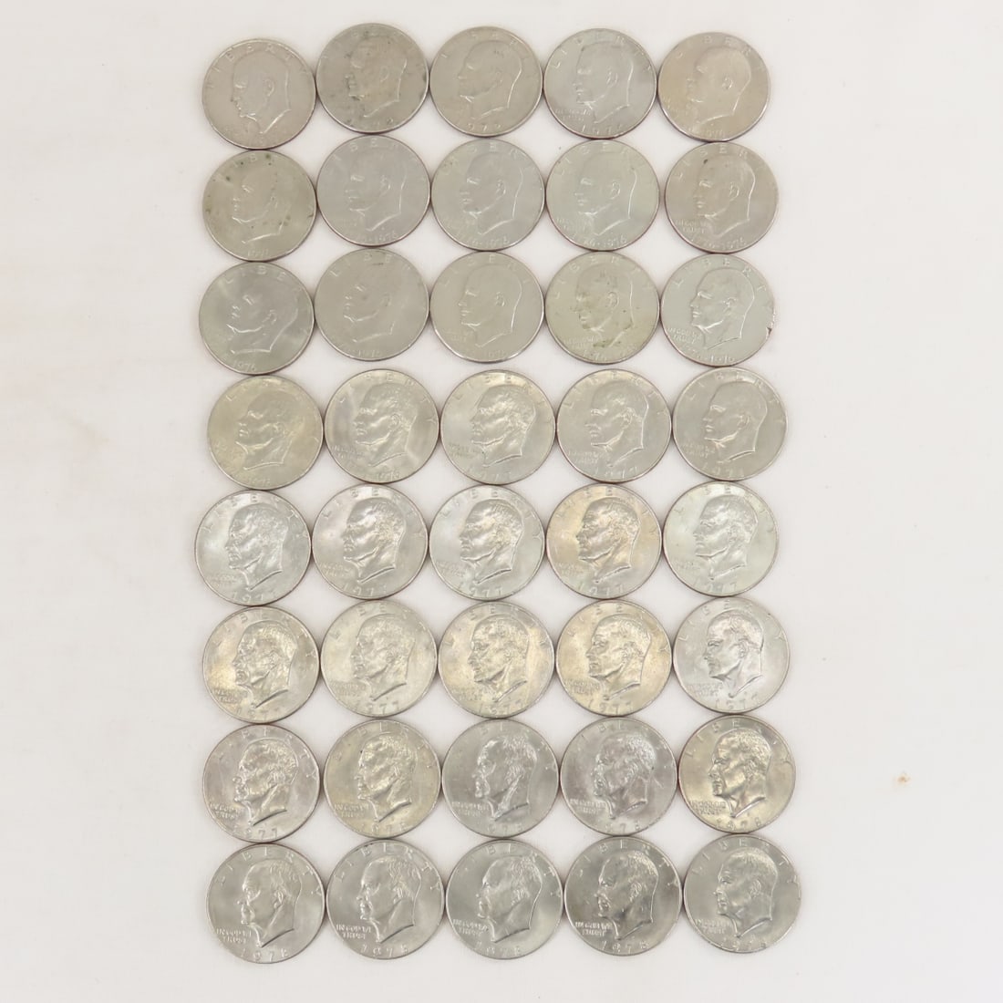 40 Mixed Date Eisenhower Dollars: 40 Mixed Date Eisenhower Dollars - Lot Size 3x3x2" 2 LB All information and photos are intended to be as accurate as possible, but errors are possible. No item may be returned or refused based on