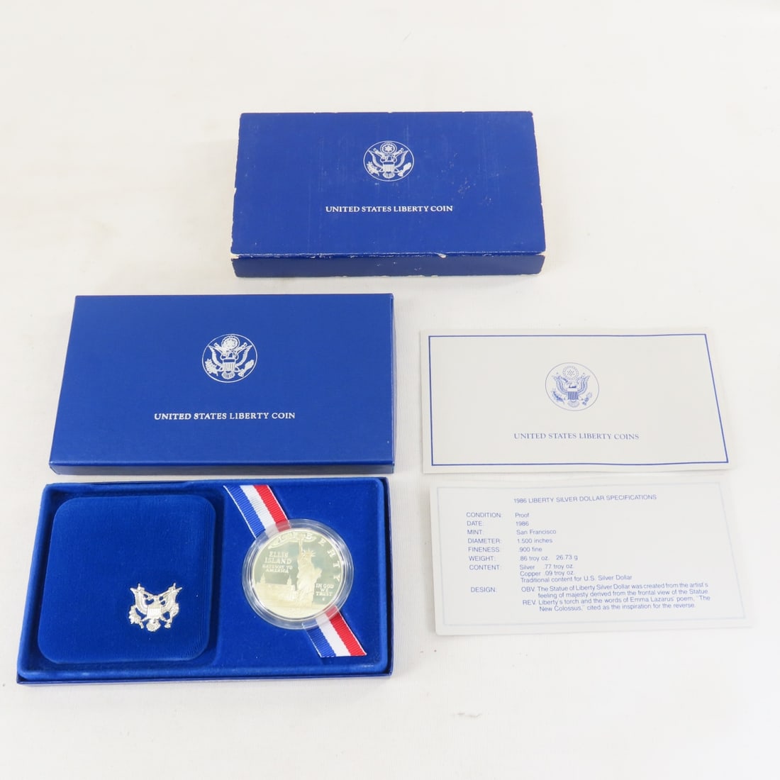 1986 S Liberty Silver Dollar Proof: 1986 S Liberty Silver Dollar Proof - with box and papers. Lot Size 6x4x1" 1 LB All information and photos are intended to be as accurate as possible, but errors are possible. No item may be returned