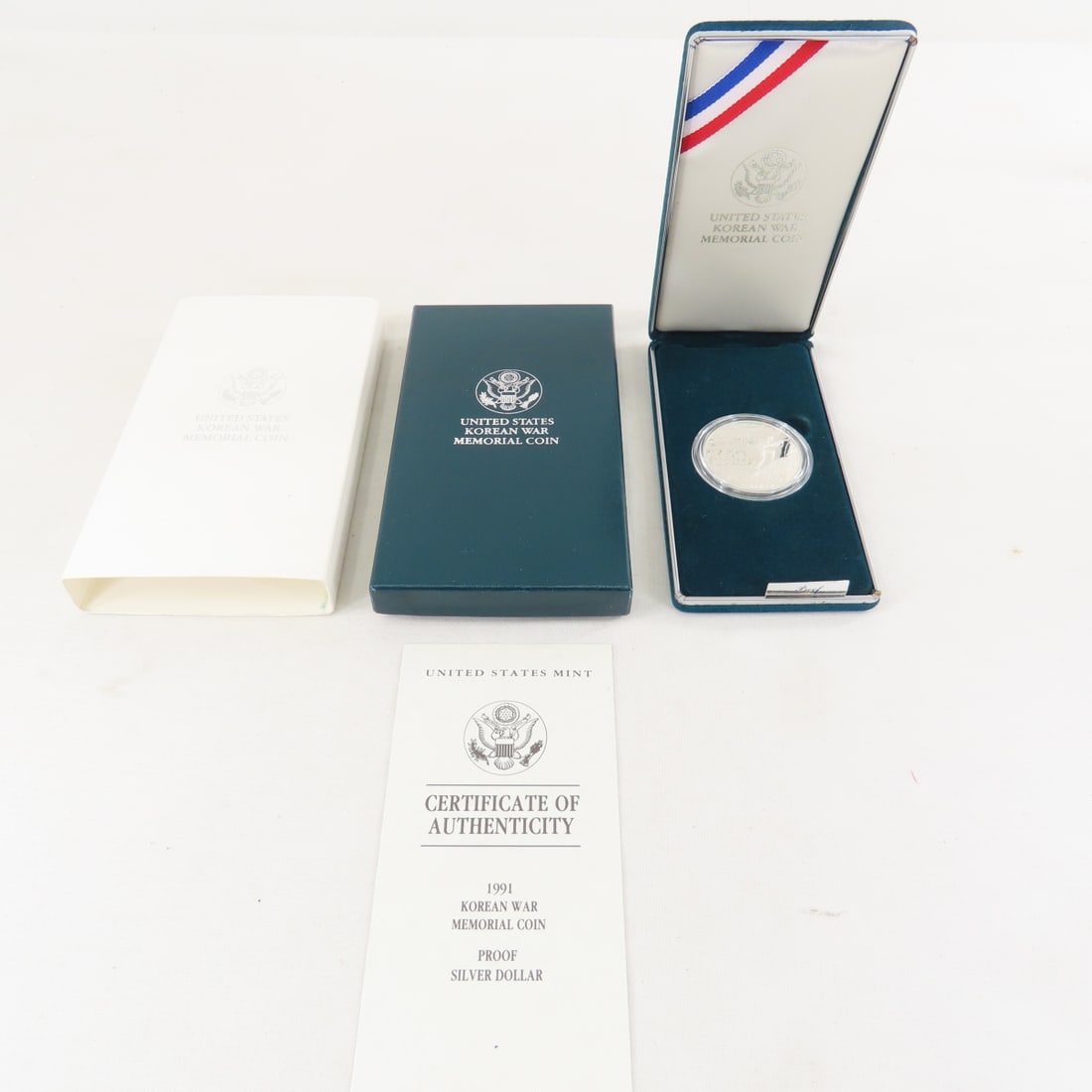 1991 P Korean War Memorial Silver Dollar Proof: 1991 P Korean War Memorial Silver Dollar Proof - with box and papers. Lot Size 6x4x1" 1 LB All information and photos are intended to be as accurate as possible, but errors are possible. No item may