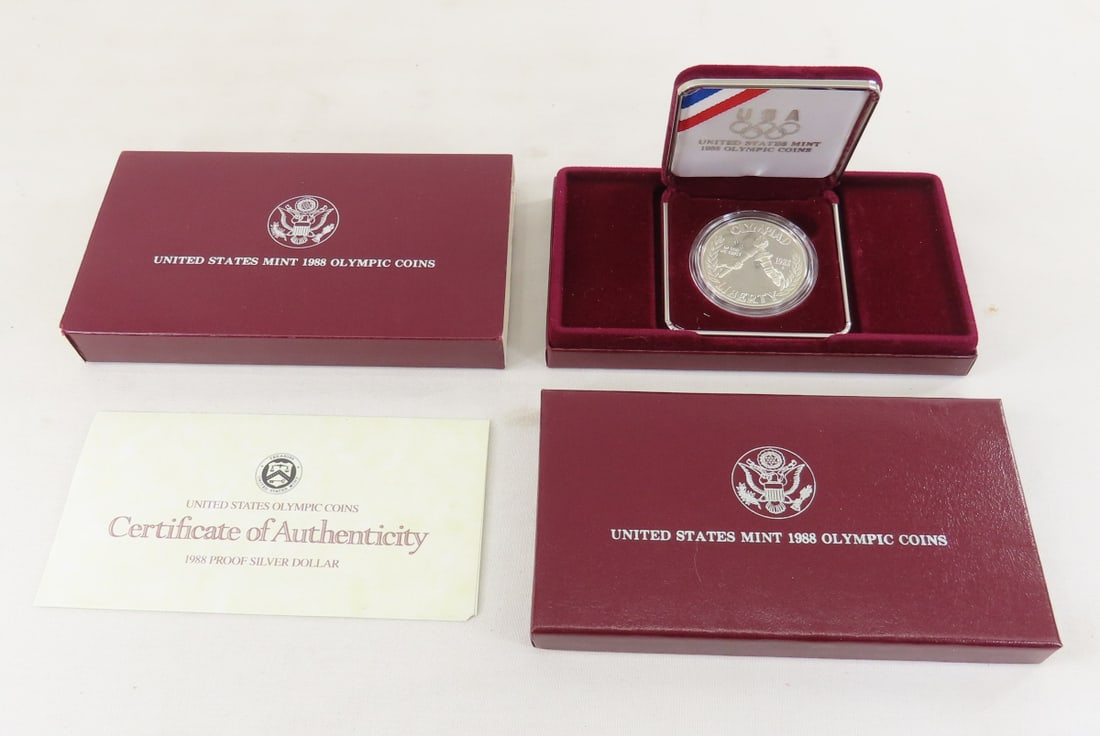 1988 S Olympic Silver Dollar Proof: 1988 S Olympic Silver Dollar Proof - with box and papers. Lot Size 6x4x1" 1 LB All information and photos are intended to be as accurate as possible, but errors are possible. No item may be returned