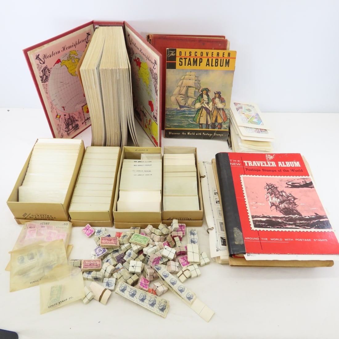 US World Stamp Collection in Books: US World Stamp Collection in Books - Brown Folder - US Stamps 44 sheets of hinge mounted US Stamps, Discoverer Stamp Album Empty, The New Traveler Album Hinge Mounted Worldwide stamps, Modern Postage