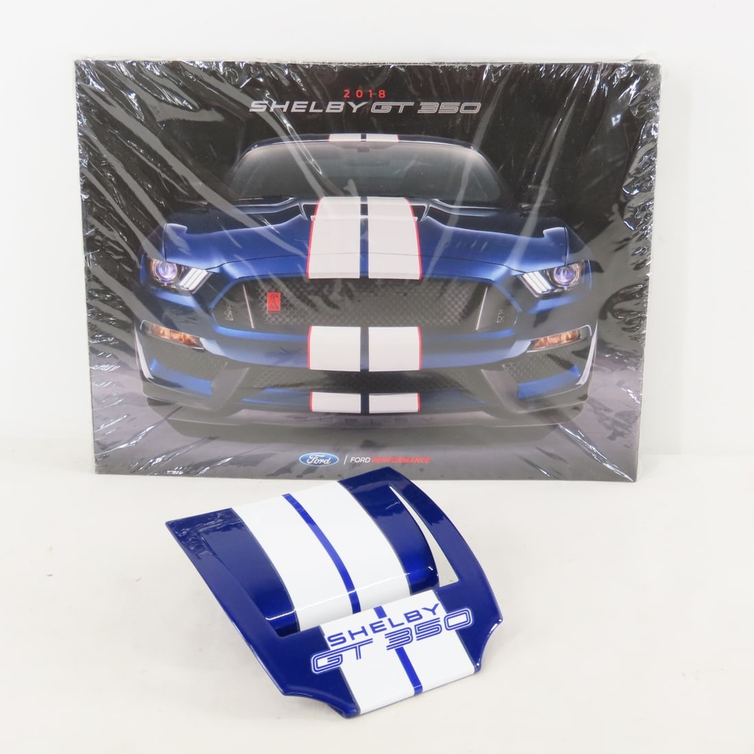 50 Shelby GT 350 2018 Brochures & Card Holder: 50 Shelby GT 350 2018 Brochures & Card Holder - dealer brochures in sealed plastic & blue metal business card holder. LOT SIZE: 12x9x4", 8.5 LBS All information and photos are intended to be as