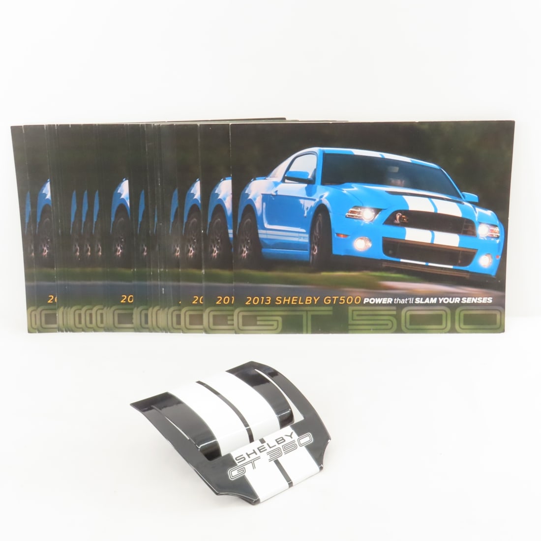 32 Shelby GT 500 Flyers & Business Card Holder: 32 Shelby GT 500 Flyers & Business Card Holder - 2013 2 sided 11x9" flyers, and black GT 350 metal business card holder. LOT SIZE: 11x9x5", 2 LBS All information and photos are intended to be as