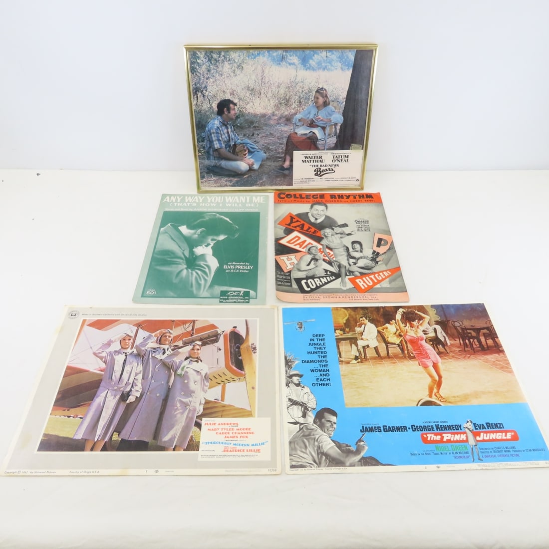 Sheet Music & Lobby Cards: Sheet Music & Lobby Cards - lobby cards: "The Bad News Bears", framed 11.5x14", "The Pink Jungle", and "Thoroughly Modern Millie". Sheet music: Elvis- "Anyway you Want Me To Be", and College Rhythm. L