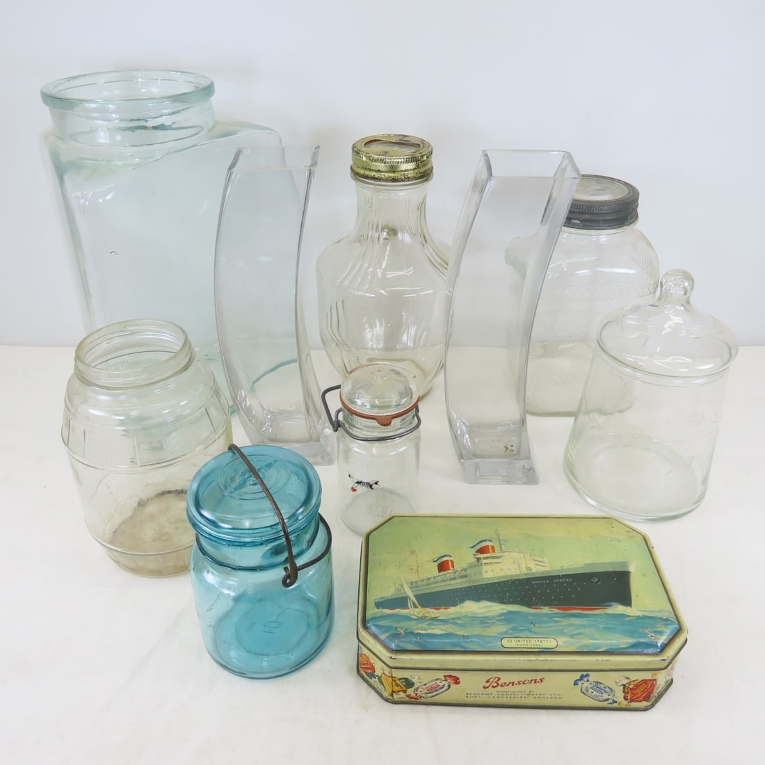 Vintage Bottles, Jars, Tin & 2 Modern Glass Vases: Vintage Bottles, Jars, Tin & 2 Modern Glass Vases - LOT SIZE: 18x12x14", 18 LBS All information and photos are intended to be as accurate as possible, but errors are possible. No item may be returned 