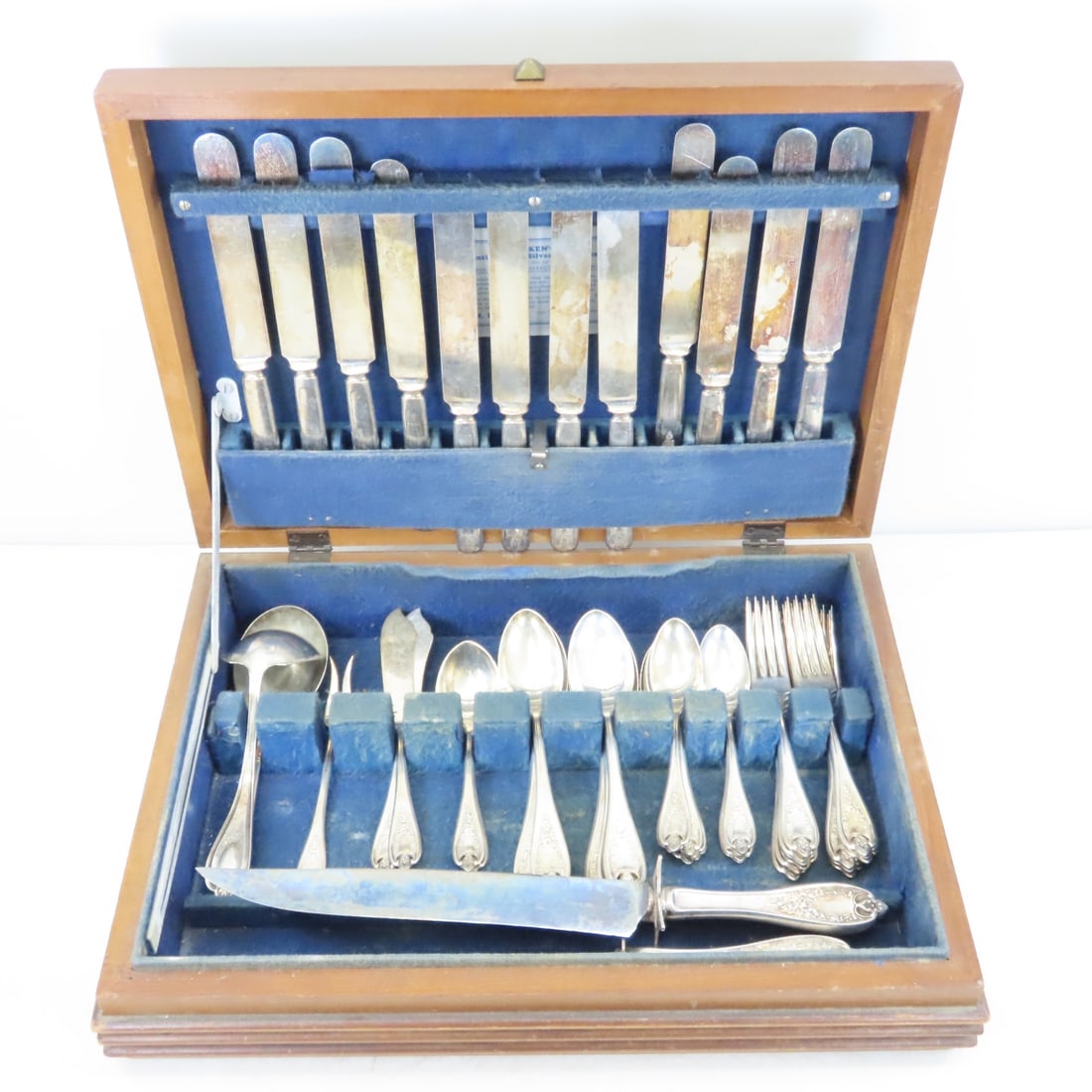 Old Colony Silverplate by Rogers: Old Colony Silverplate by Rogers - carving knife and sharpener, 12 knives, 12 dinner forks, 11 teaspoons, 12 tablespoons, 2 sugar spoons, 2 butter knives, large serving spoon, ladle, pickle fork, in