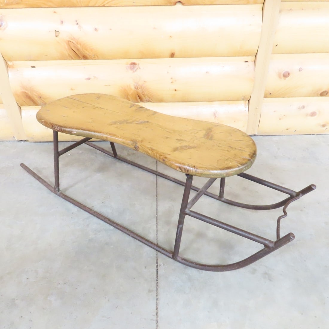 Antique Iron Frame Children's Ice Sled: Antique Iron Frame Children's Ice Sled - Wood Seat is 10.5" high and 25" long. Lot Size: 34 x 10 x 10", 9 lbs All information and photos are intended to be as accurate as possible, but errors are
