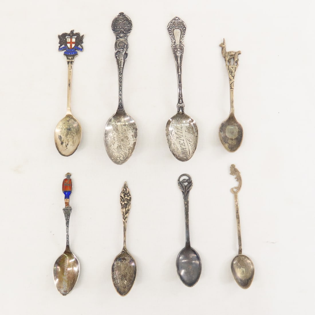 Sterling & 900 Silver Souvenir Travel Spoons: Sterling & 900 Silver Souvenir Travel Spoons - Sterling: Bozeman, MT, Lake Mills, IA, St. Croix Valley, Niagara Falls, Port Arthur Canada (enamel Mountie handle), London (enamel cross handle), 900 sil