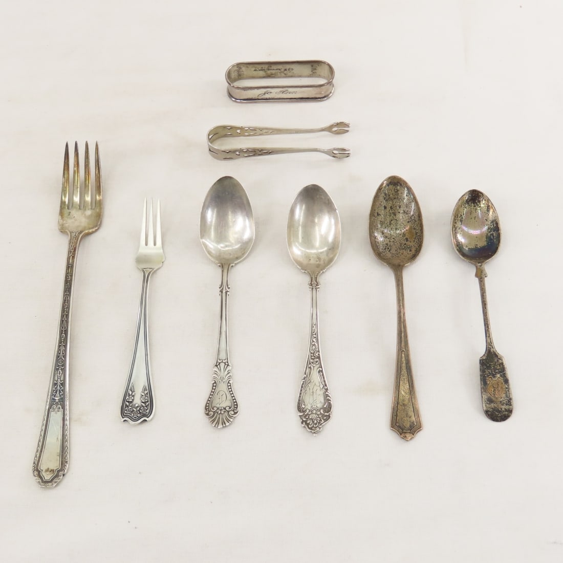 Sterling Silver Flatware, Sugar Tong & Napkin Ring: Sterling Silver Flatware, Sugar Tong & Napkin Ring - 2 Watson monogrammed spoons- different patterns, spoon engraved "Virginia", spoon with unidentified logo, long fork, SSMC marked cocktail fork, Web