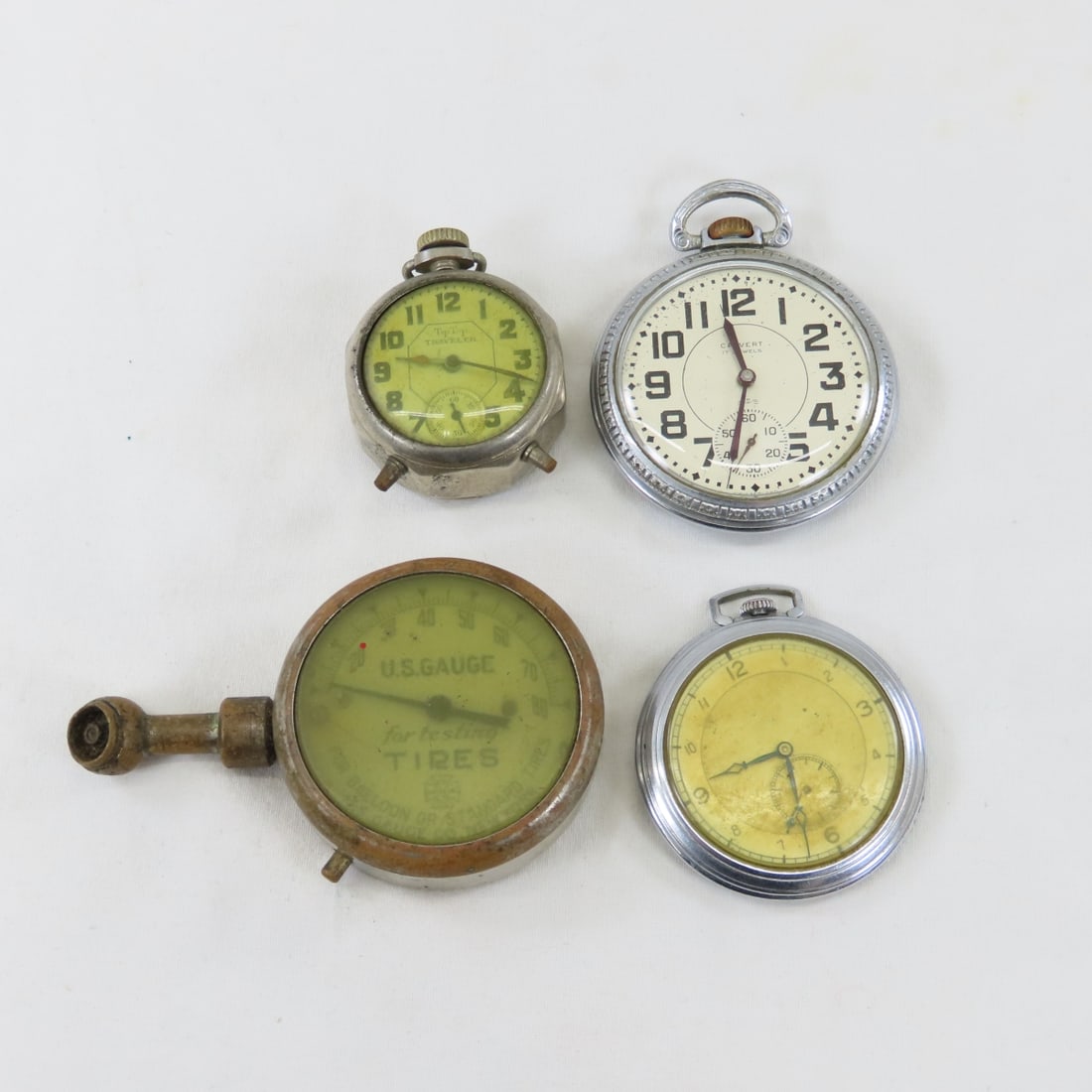 US Tire Gauge, Travel Clock & 2 Pocket Watches: US Tire Gauge, Travel Clock & 2 Pocket Watches - Tip Top Traveler clock- not working. Calvert 17 Jewel Avalon movement pocket watch - not working. Central W Co 7 jewel open face pocket watch- loose