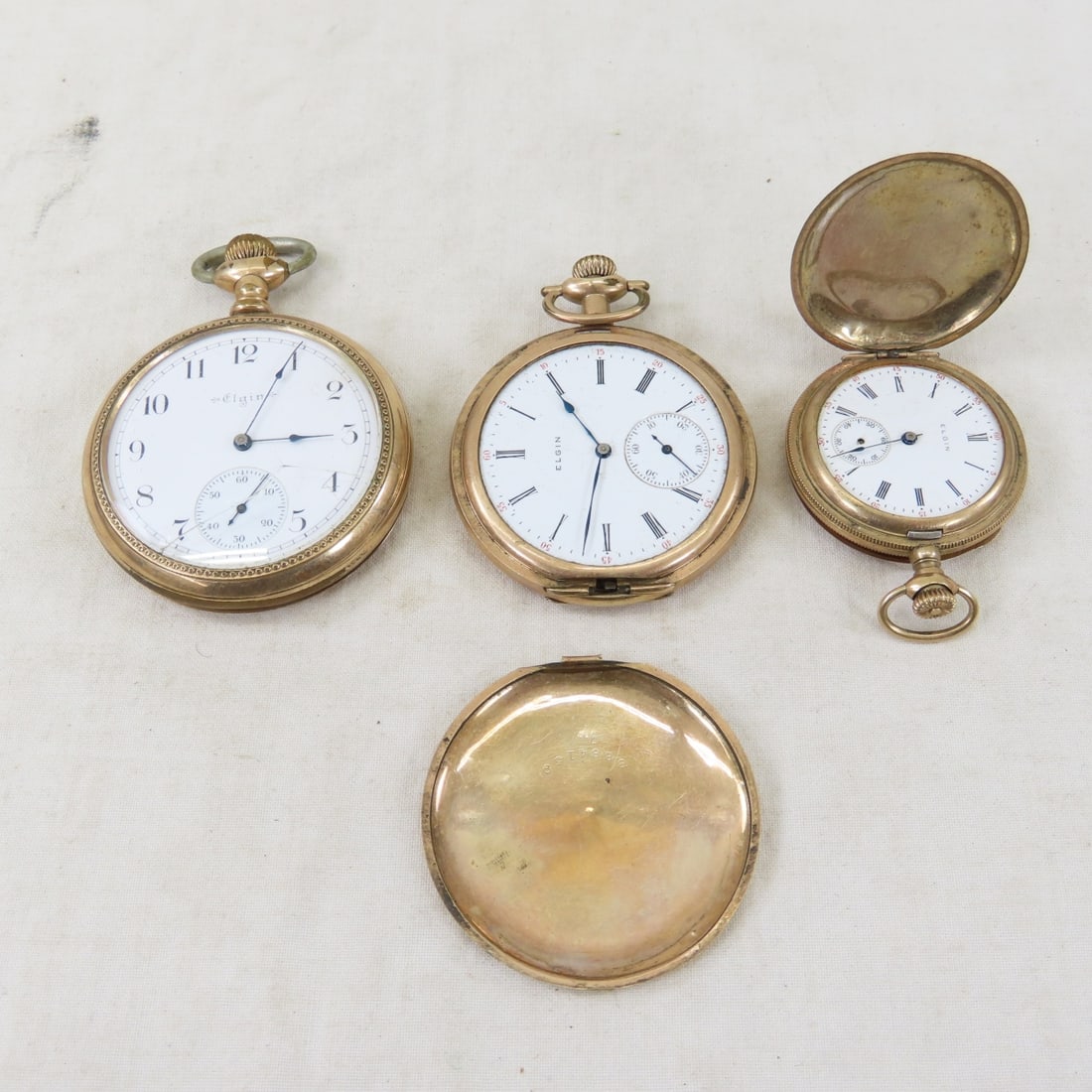 3 Elgin Pocket Watches for Parts or Repair: 3 Elgin Pocket Watches for Parts or Repair - none are working 1) 1900 Elgin 15 jewel, 16s, open face screw- set, model 7., grade 186, SN# 8275020, in 20 year Montauk case- wound tight, cracked crystal